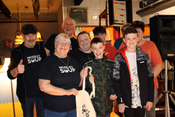 Mossley SOUP volunteers with members of S.P.E.L.L